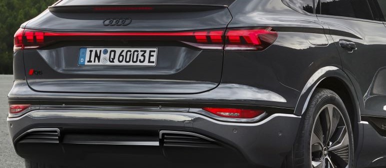 A close-up of the rear lighting system of the Audi Q6 e-tron which integrates six digital rear Atala OLED 2.0 panels, featuring 360 individually addressable, software-controlled segments.