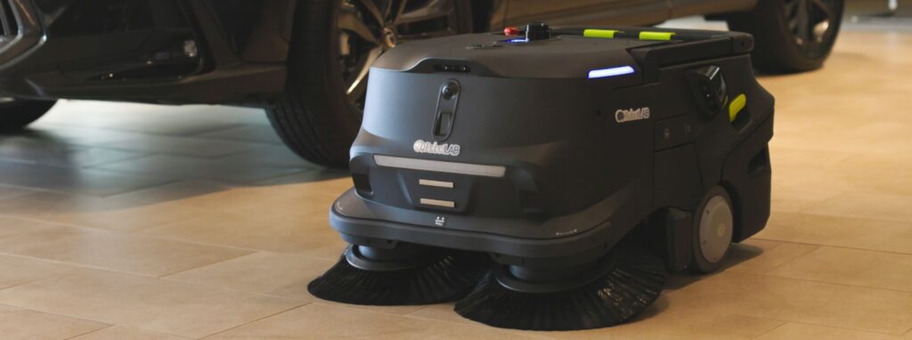 A cleaning robot in a dealer showroom.